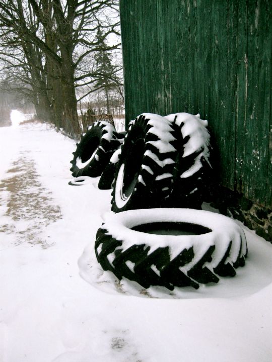 Tires by the green shed